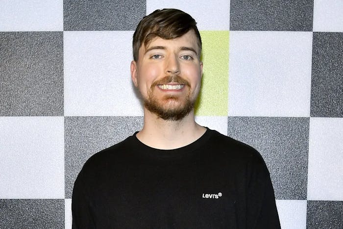 MrBeast standing in front of a chess board