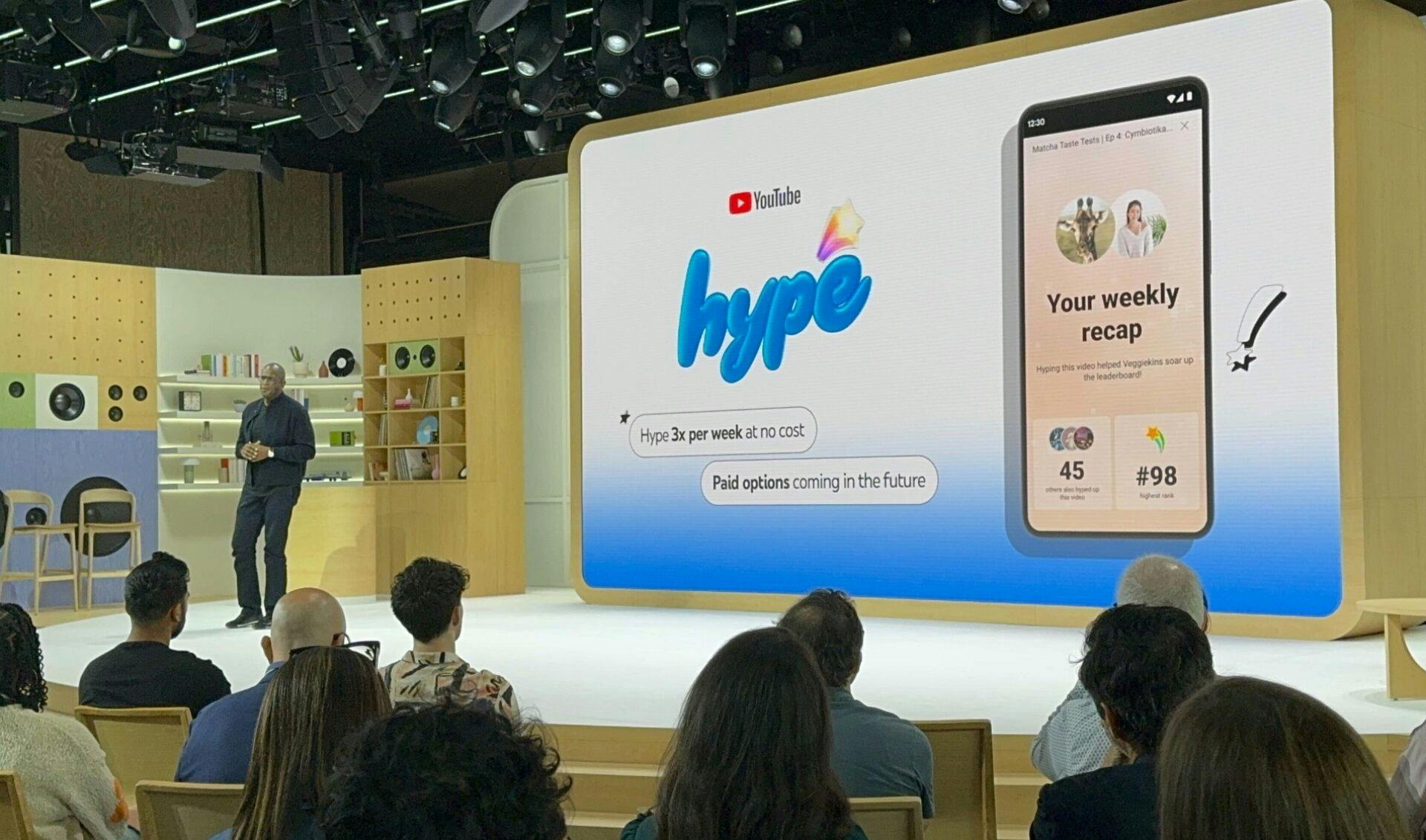 Presenter from YouTube stands on stage and explains the new Hype feature